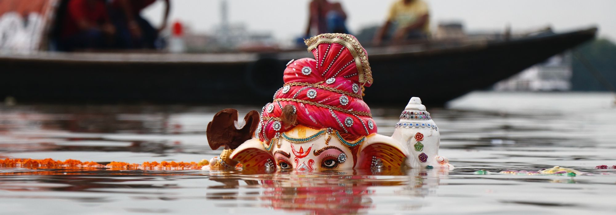 Lord Ganesha statuette in water